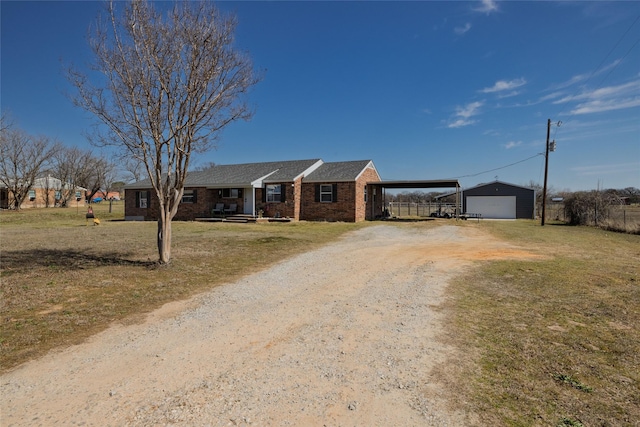 12510 Liberty School Rd, Azle, TX 76020 - ranch-style home featuring an outbuilding, driveway, a carport, a detached garage, and brick siding