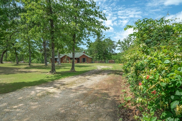 2766 Vz County Road 3104, Edgewood, TX 75117 - view of front of house with a chimney, driveway, covered porch, an outbuilding, and a garage
