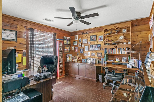 office featuring a ceiling fan, visible vents, a textured ceiling, and wood finished floors