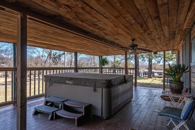 sunroom / solarium featuring wood ceiling and ceiling fan