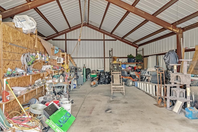 garage featuring a workshop area and metal wall