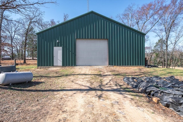 detached garage featuring driveway