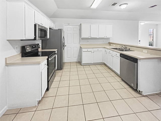kitchen featuring visible vents, stainless steel appliances, a sink, and light countertops