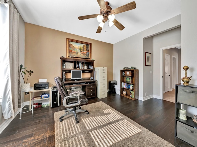 office area featuring a ceiling fan, baseboards, and hardwood / wood-style floors