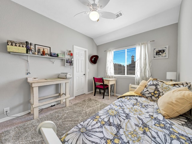 carpeted bedroom with lofted ceiling, ceiling fan, visible vents, and baseboards