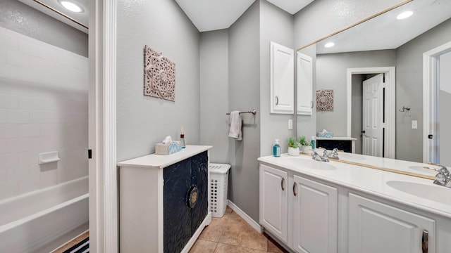 full bathroom featuring double vanity, tile patterned flooring, a sink, and recessed lighting