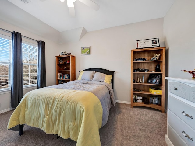 carpeted bedroom with ceiling fan, baseboards, and vaulted ceiling