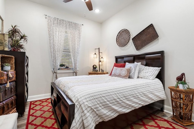 bedroom featuring ceiling fan, recessed lighting, wood finished floors, and baseboards