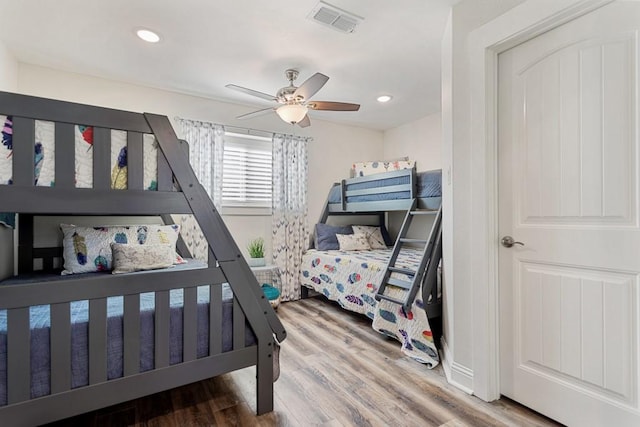 bedroom featuring ceiling fan, wood finished floors, visible vents, and recessed lighting