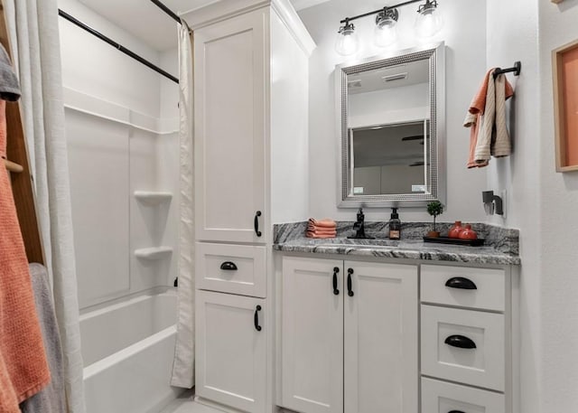 full bathroom featuring shower / bath combo and vanity