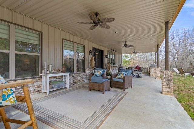 view of patio featuring ceiling fan