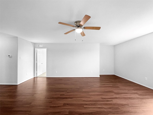 unfurnished room featuring ceiling fan, baseboards, and wood finished floors