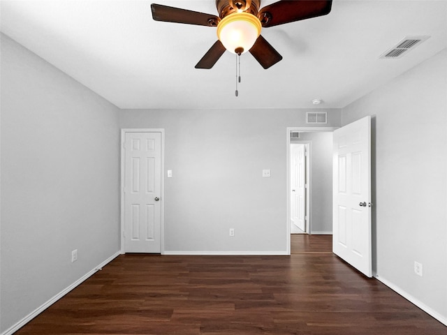 interior space with visible vents, baseboards, and wood finished floors