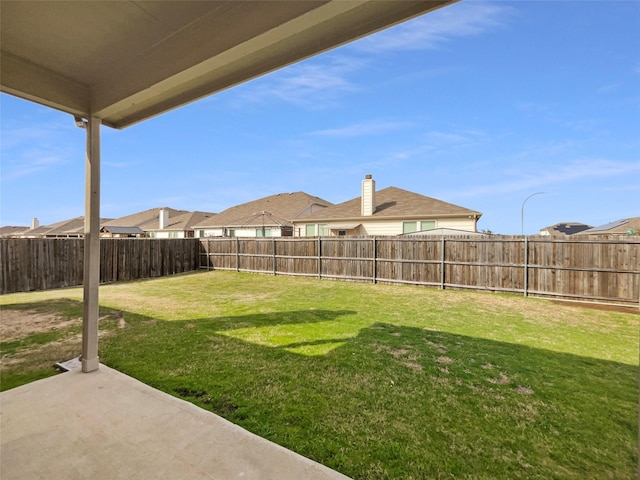 view of yard with a patio and a fenced backyard