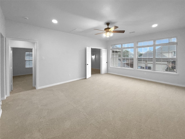 carpeted empty room with ceiling fan, recessed lighting, and baseboards