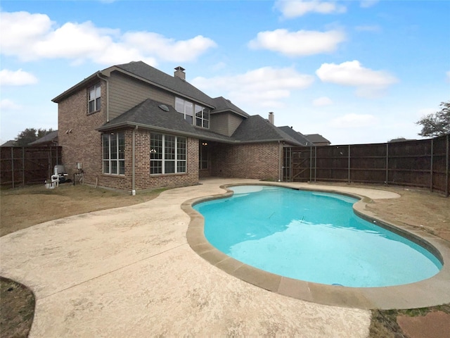 view of pool with a fenced in pool, a patio area, and a fenced backyard