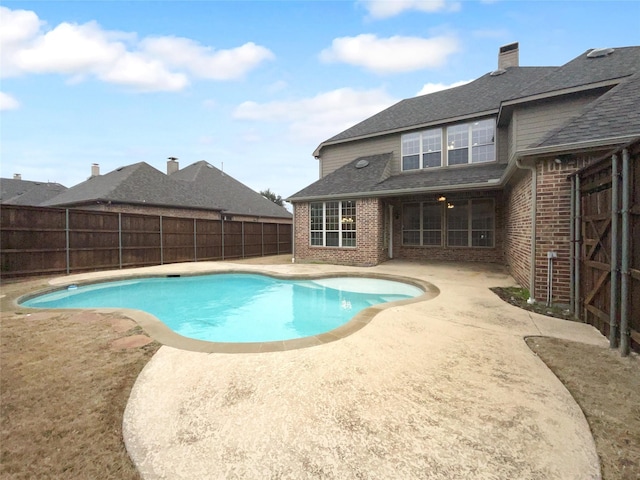 view of pool with a fenced backyard, a fenced in pool, and a patio