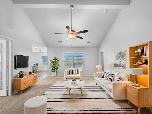 living area featuring a ceiling fan, light carpet, and high vaulted ceiling