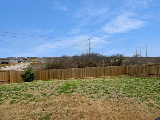 view of yard with a fenced backyard