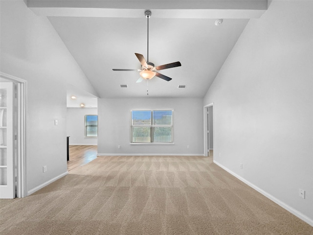 unfurnished living room featuring high vaulted ceiling, ceiling fan, baseboards, and light colored carpet