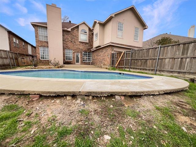 view of swimming pool with a fenced in pool, a patio area, and a fenced backyard