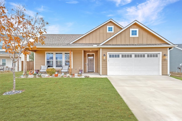 view of front of home with a garage, driveway, board and batten siding, and a front lawn