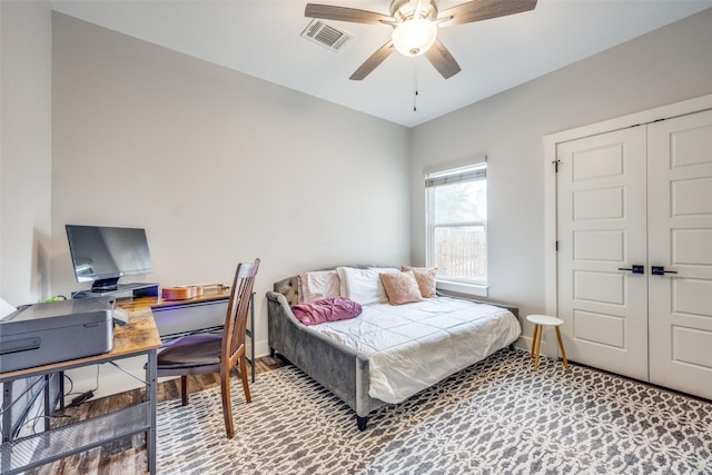 bedroom featuring visible vents, baseboards, a closet, and a ceiling fan