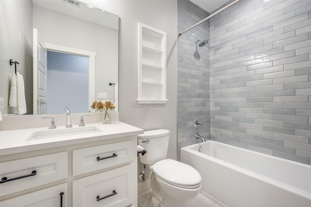 bathroom featuring visible vents, toilet, built in features,  shower combination, and vanity