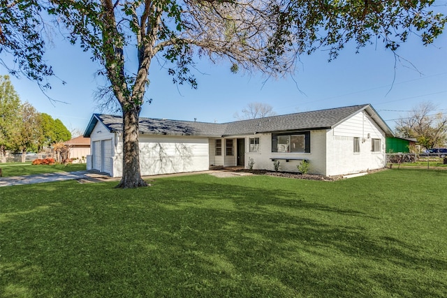 ranch-style home featuring an attached garage, driveway, fence, and a front yard