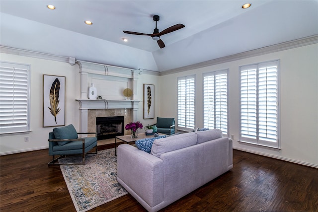 living area featuring recessed lighting, a fireplace, vaulted ceiling, dark wood-style floors, and crown molding