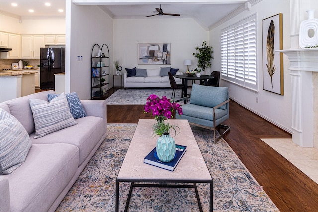 living room with dark wood-style flooring, crown molding, lofted ceiling, recessed lighting, and ceiling fan