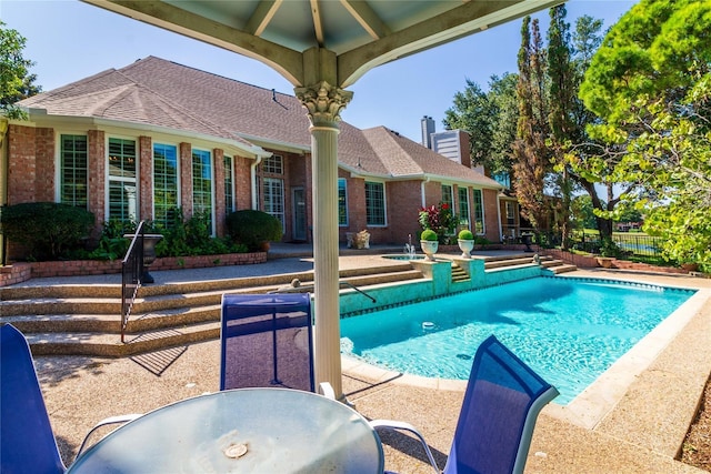 view of pool with outdoor dining space, a patio area, fence, and a fenced in pool