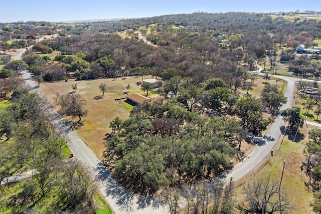 birds eye view of property with a wooded view