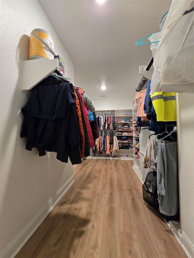 walk in closet featuring light wood-type flooring