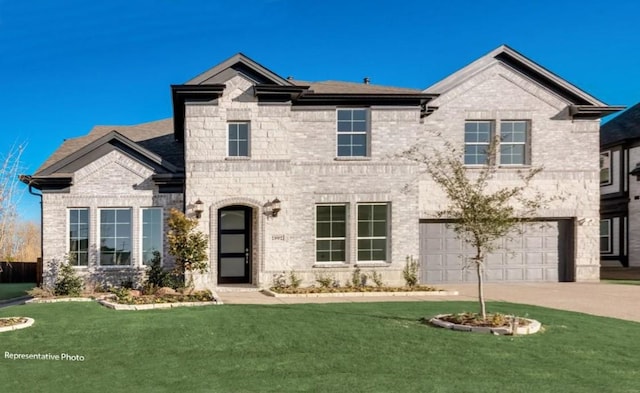 view of front of house featuring a garage, driveway, a front lawn, and brick siding