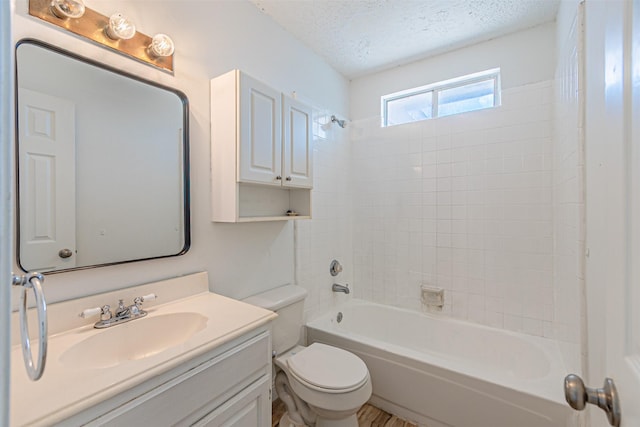 1542 Home Park Dr, Allen, TX 75002 - bathroom featuring toilet, vanity, a textured ceiling, and shower / bath combination