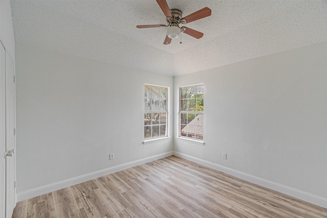 1542 Home Park Dr, Allen, TX 75002 - spare room with a textured ceiling, light wood-type flooring, a ceiling fan, and baseboards