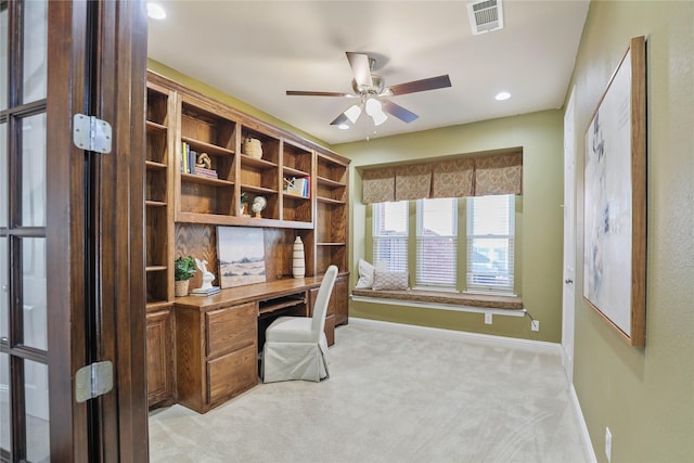 office space with a ceiling fan, light carpet, baseboards, visible vents, and recessed lighting