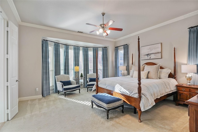 bedroom with baseboards, visible vents, light colored carpet, and crown molding