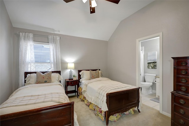 bedroom with ensuite bathroom, ceiling fan, light carpet, baseboards, and lofted ceiling
