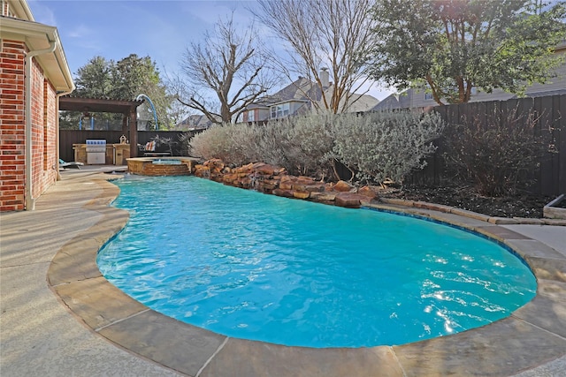 view of pool featuring a patio area, a fenced backyard, a fenced in pool, and an in ground hot tub