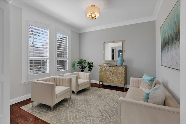 living area featuring ornamental molding, wood finished floors, and baseboards