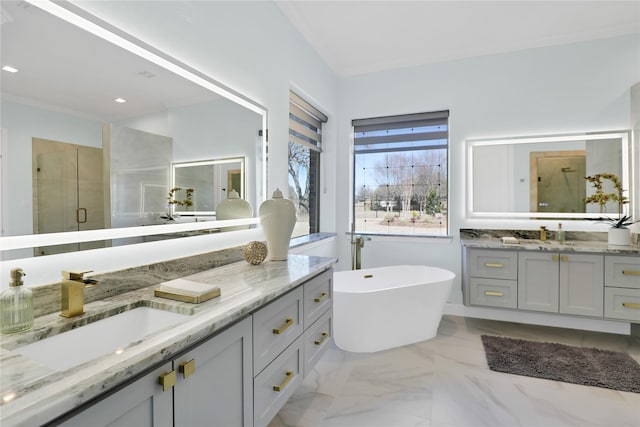 full bath with marble finish floor, two vanities, a sink, and a shower stall