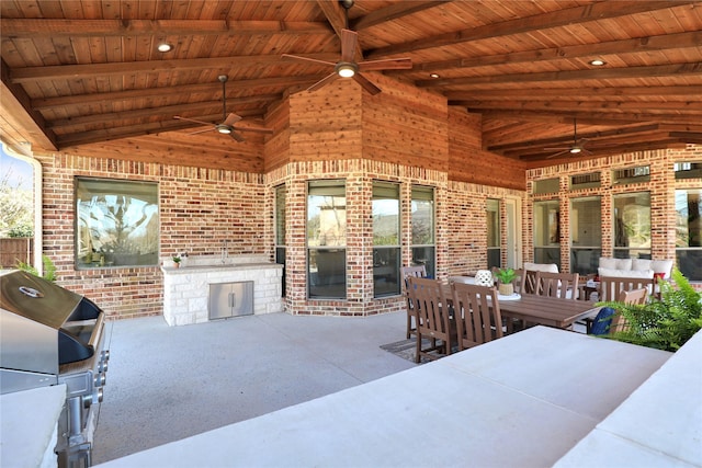 view of patio featuring ceiling fan, outdoor dining space, and area for grilling