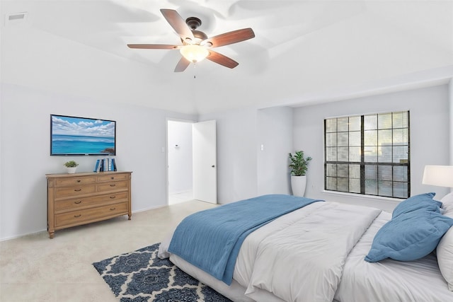 bedroom featuring a ceiling fan, light colored carpet, and visible vents