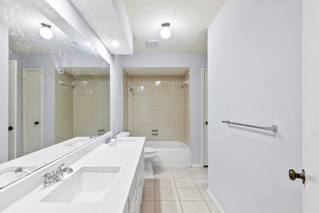 full bath featuring a textured ceiling, visible vents, a sink, and tile patterned floors