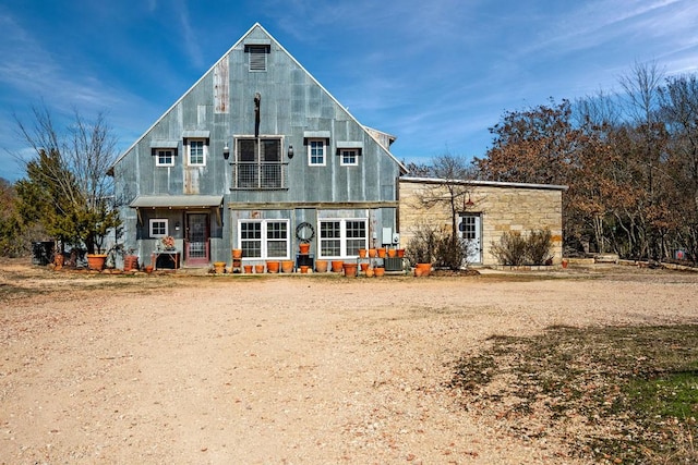 rear view of property with central AC unit