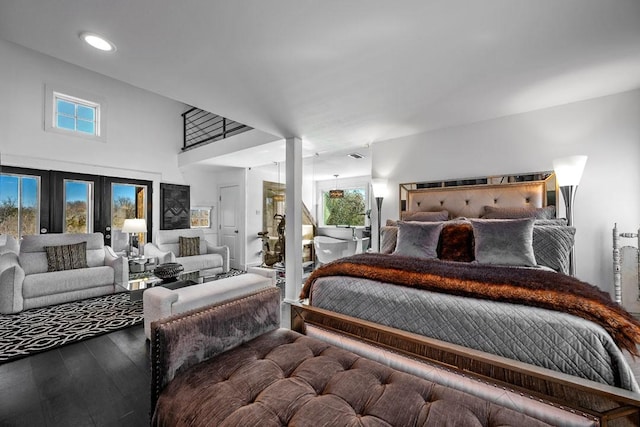 bedroom with french doors, wood finished floors, and recessed lighting