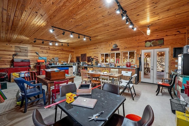 game room featuring wood ceiling, french doors, wood walls, and rail lighting