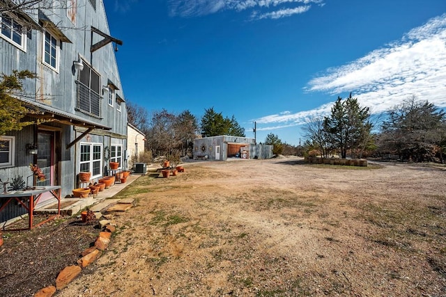 view of yard featuring central AC unit